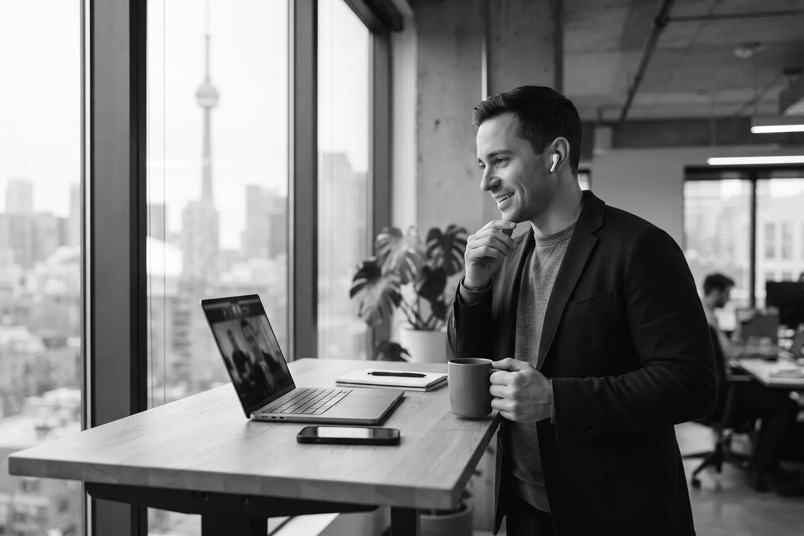 Strategist on a video call at a standing desk overlooking downtown Toronto
